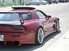 need opinions or a photoshop please-mazda_rx7_chargespeed_widebody_magenta_sidefromrearcorner.jpg