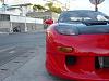 Black hood on red car-front-drivers-side.jpg